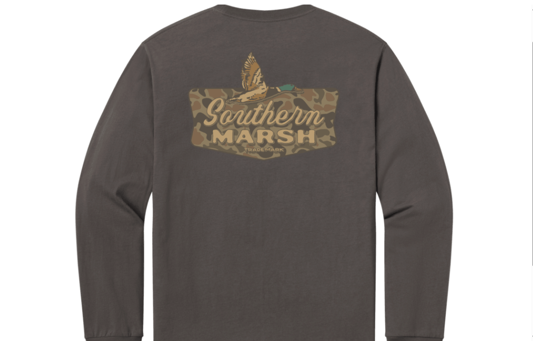 A dark brown long-sleeve t-shirt shown from the back, featuring a camouflage graphic with a duck and the text 'Southern Marsh' on the upper back.
