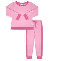 A two-piece children's pajama set in pink, featuring a long-sleeve top with contrasting pink cuffs and hem, and matching jogger pants with a pink side stripe and drawstring waist, displayed on a solid gray background.