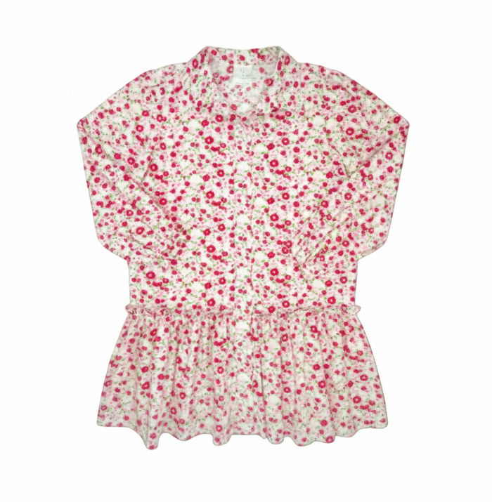 A long-sleeve collared blouse with a dense pink and red floral print on a white background, shown against a solid gray background.