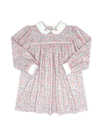 A long-sleeve baby dress with a delicate pink, blue, and white floral print, featuring a white Peter Pan collar with embroidered cartoon details and white cuffs.