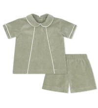 A two-piece toddler bedding set in sage green corduroy, featuring a short-sleeve top with a Peter Pan collar and white piping, paired with matching shorts.