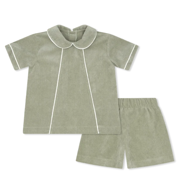 A two-piece toddler bedding set in sage green corduroy, featuring a short-sleeve top with a Peter Pan collar and white piping, paired with matching shorts.