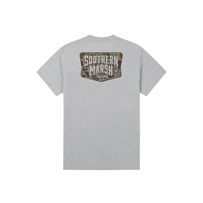 A light gray heather crewneck t-shirt shown from the back, featuring a camouflage patch graphic with the words 'SOUTHERN MARSH' in white block letters.