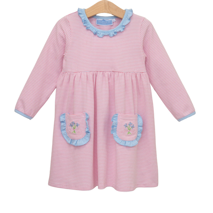 Pink striped dress with blue accents on a hanger against a white background