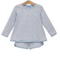 Children's blue and white striped pajama set on a hanger against a white background