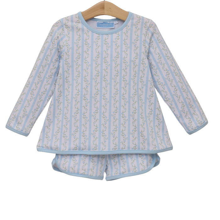 Children's blue and white striped pajama set on a hanger against a white background