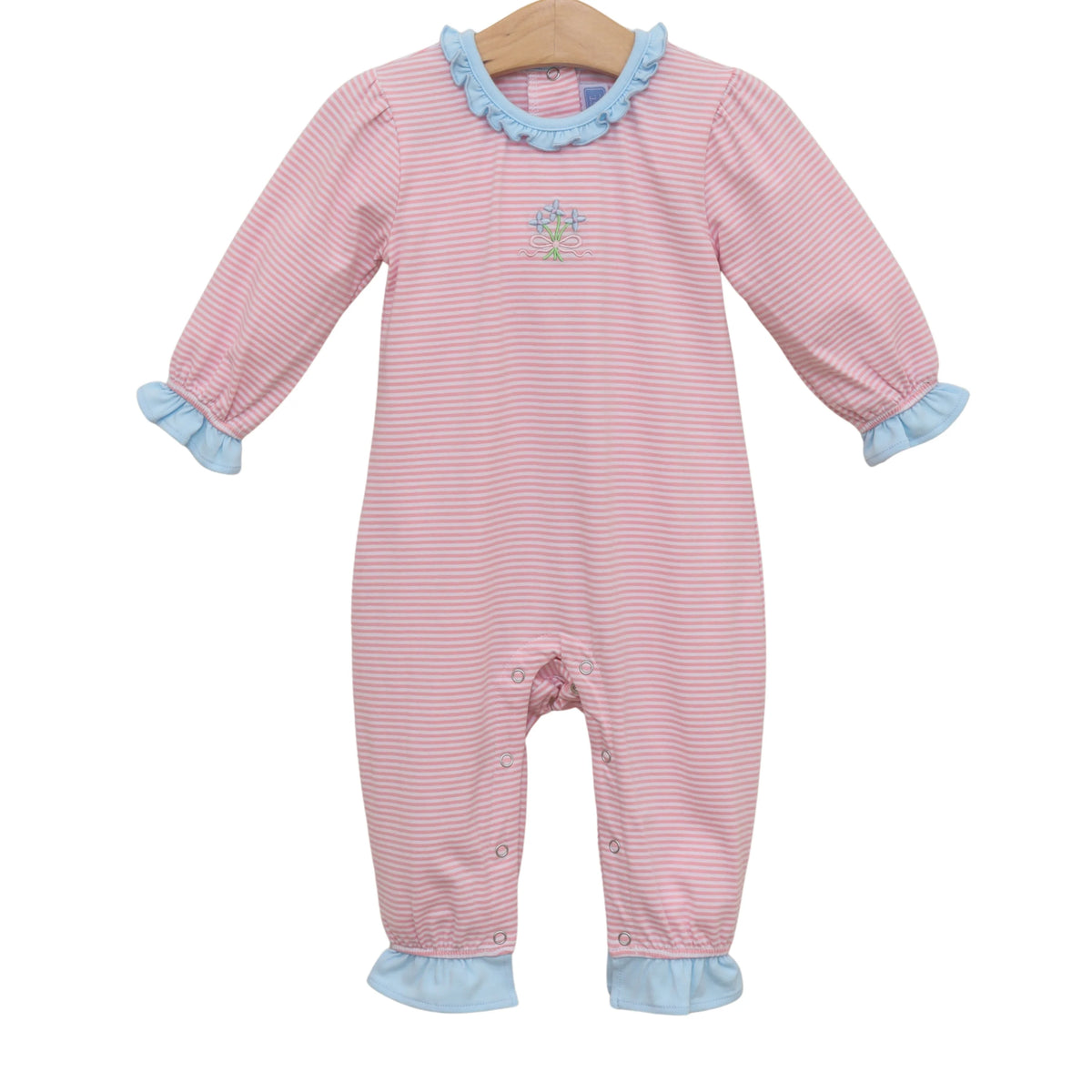 Pink and blue striped baby onesie on a hanger with a white background