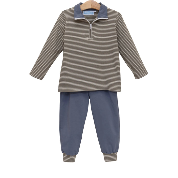 A two-piece children's outfit set featuring a long-sleeve quarter-zip pullover top with beige and navy horizontal stripes, and matching navy blue pants with striped cuffs, displayed on a wooden hanger against a white background.