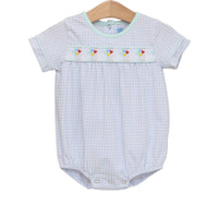 Baby romper with checkered pattern and embroidered details on a white background
