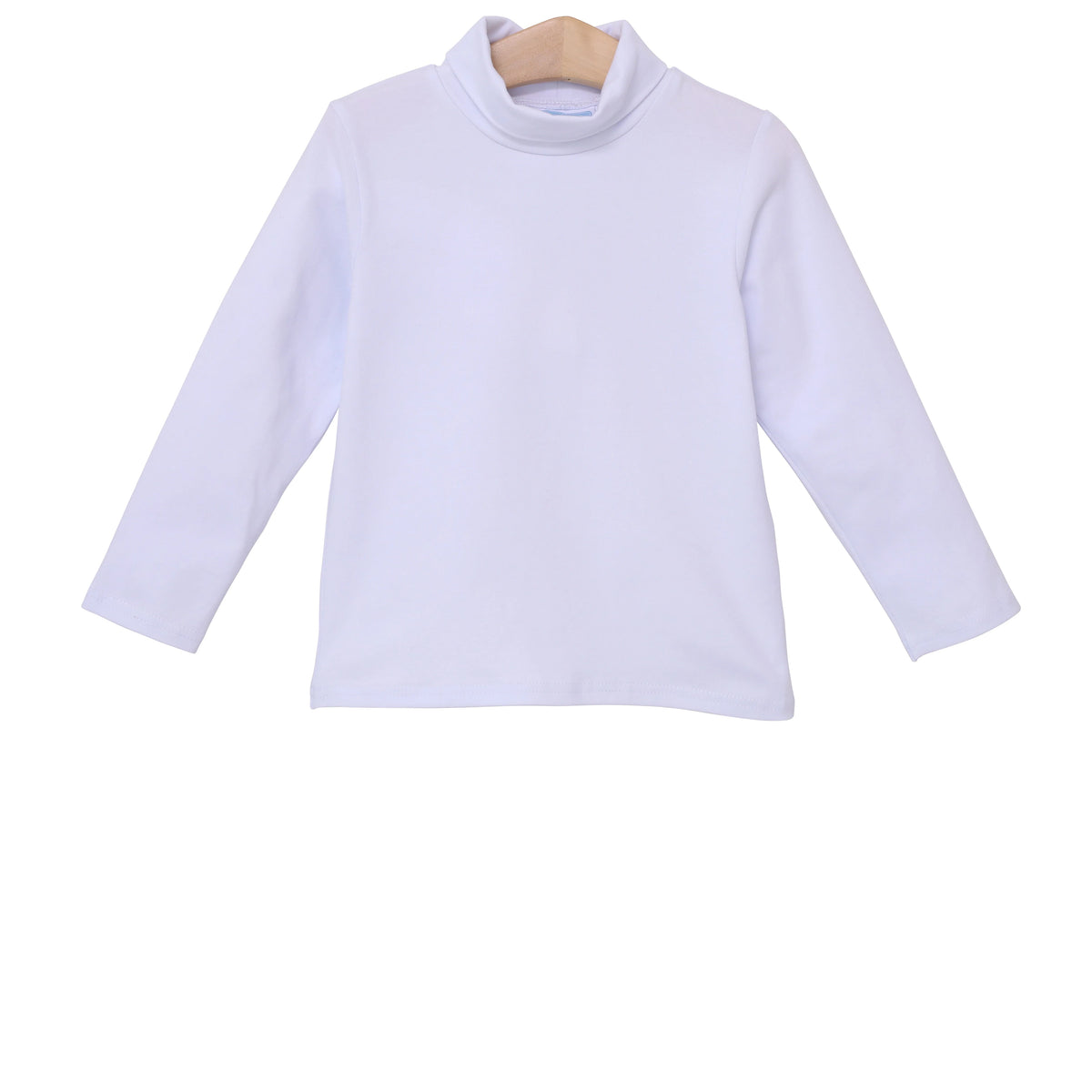 White long-sleeve shirt on a wooden hanger against a white background