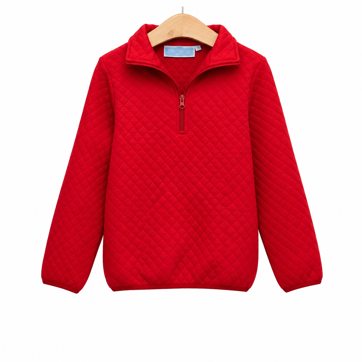 A bright red quilted long-sleeve quarter-zip pullover sweater hanging on a wooden hanger against a plain white background.