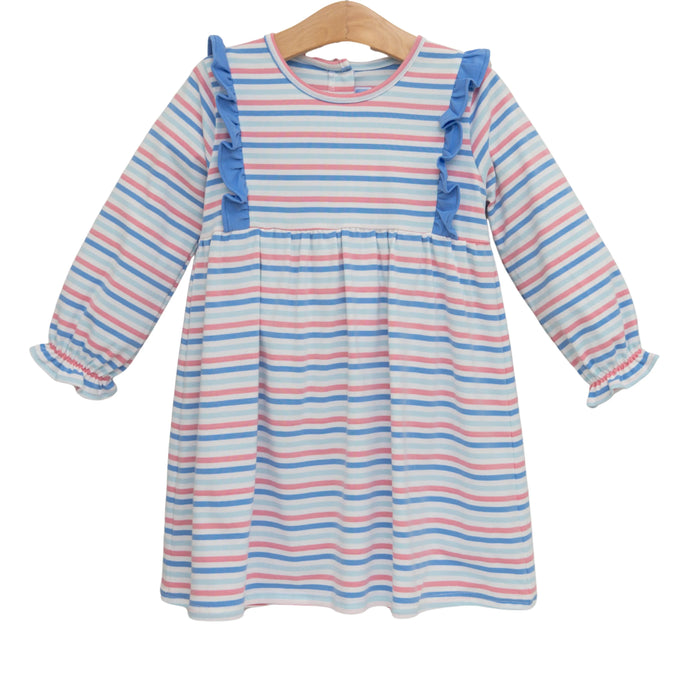 A long-sleeve baby girl's dress with horizontal stripes in blue, pink, and white, featuring ruffle details on the shoulders and cuffs, hanging on a wooden hanger against a white background.