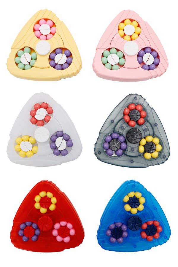 Six triangular plastic puzzle pieces arranged in a 2x3 grid on a white background, each featuring three circular bead rings in different color combinations: yellow and pink, white and gray, red and blue.