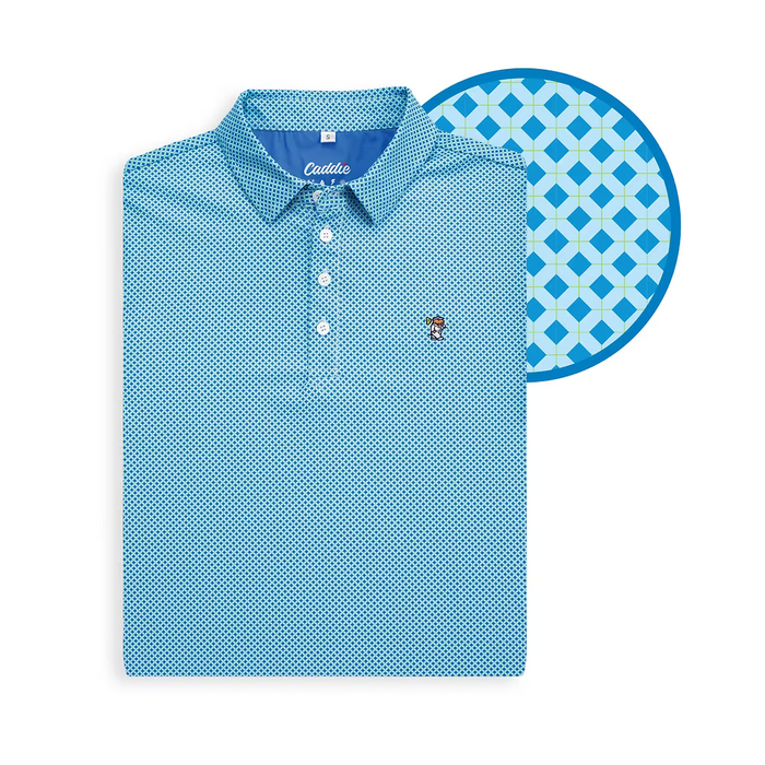 A folded light blue polo shirt with a small geometric pattern, shown next to a circular close-up of the fabric pattern. The brand name 'Cauda' is visible on the inner neck label.
