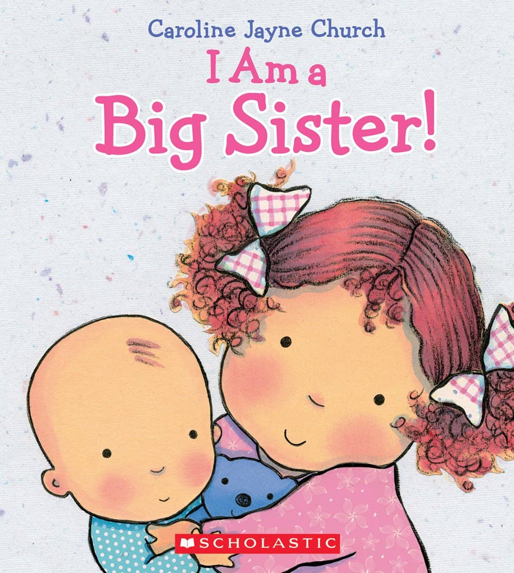 Children's book cover titled "I Am a Big Sister!" by Caroline Jayne Church, featuring an illustrated older girl with curly red hair and a pink bow hugging a baby, with the Scholastic logo at the bottom.