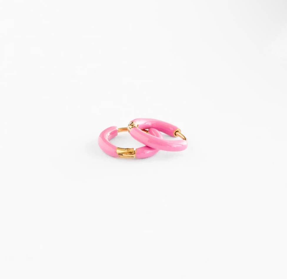 Pink hoop earrings with gold accents on a white background