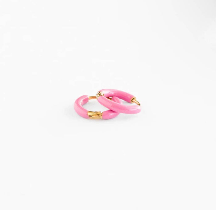 Pink hoop earrings with gold accents on a white background