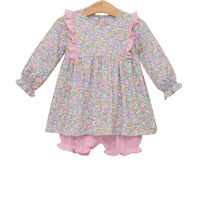 Floral dress with pink ruffles on a white background