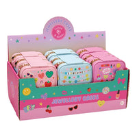 A retail display box filled with small square jewellery cases in pastel pink, light blue, and pink, decorated with colorful heart, star, and lipstick-themed graphics. The display board reads 'JEWELLERY CASES' and 'FLOSS & FOLD'.