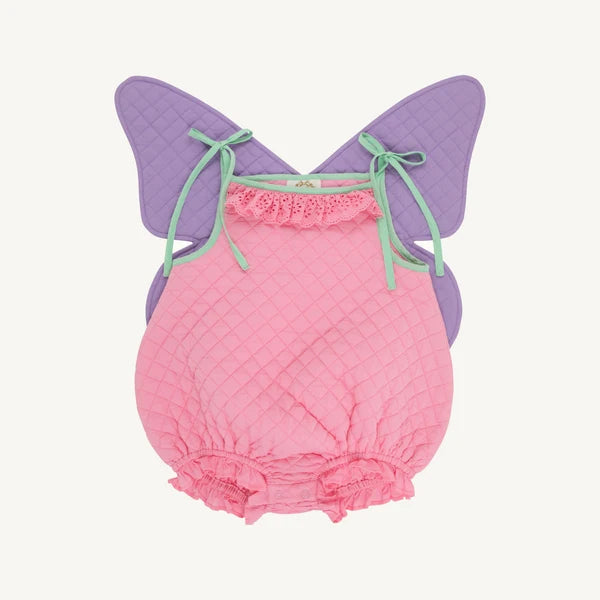 A baby bodysuit or romper with a quilted pink front, ruffled trim, and attached purple wings with mint green ties, shown on a plain light background.