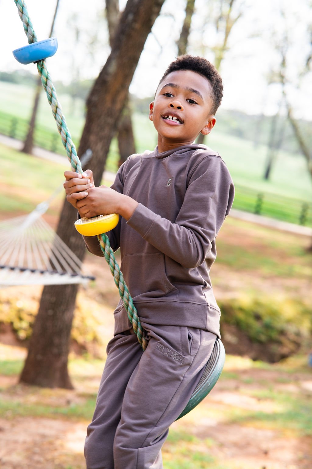 Child on a swing set in a park