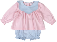A baby girl's two-piece outfit featuring a long-sleeve top in pink with a light blue scalloped collar, paired with matching light blue ruffled bloomers, shown on a plain white background.
