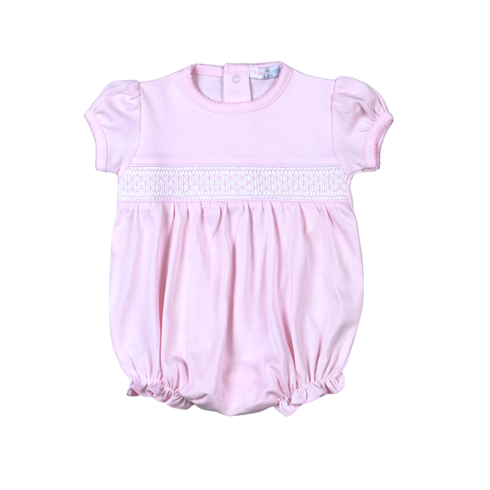 Pink baby romper with lace detail on a white background