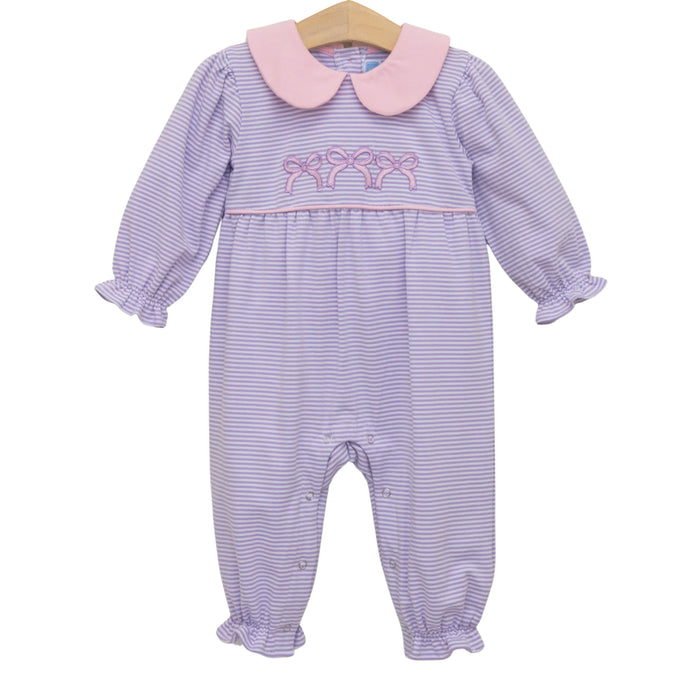 A baby girl's long-sleeve footless romper with lavender and white stripes, a pink Peter Pan collar, and pink bow embroidery on the chest, hanging on a wooden hanger against a white background.