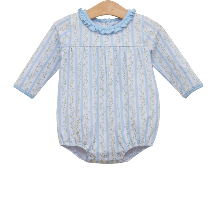 A baby long-sleeve romper hanging on a wooden hanger against a white background. The romper features light blue and white vertical stripes with a delicate green floral pattern, a light blue ruffled collar, and snap closures at the crotch.