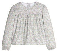 Floral blouse with long sleeves on a white background