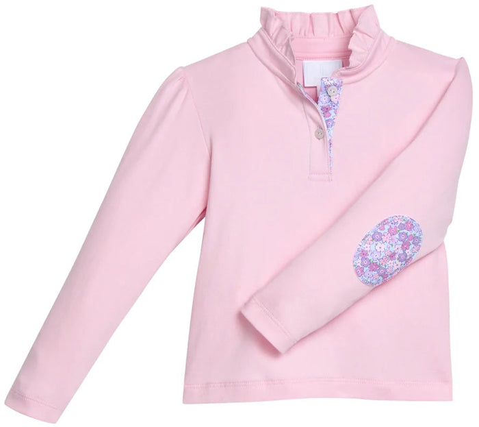 A pink long-sleeve mock neck top with a buttoned placket and a floral patch on the left elbow, shown on a plain white background.