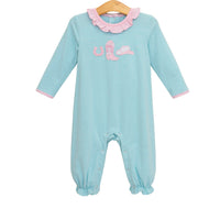 A baby long-sleeve footless jumpsuit in light blue and white stripes, featuring a pink ruffled collar, pink trim on the cuffs, and a pink mermaid tail graphic on the chest, hanging on a wooden hanger against a white background.
