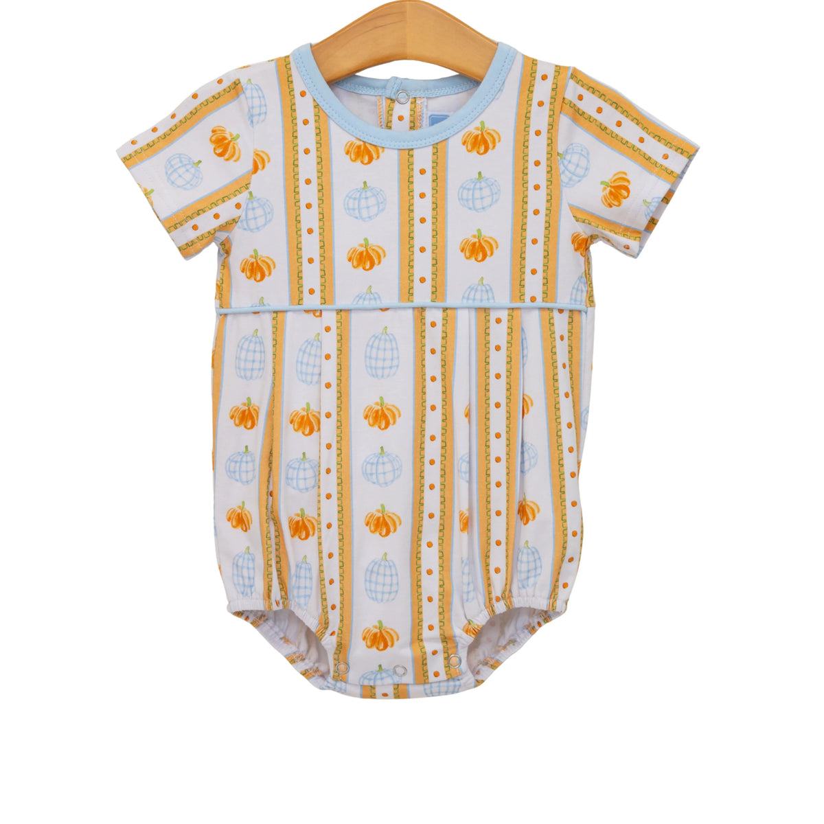 A baby short-sleeve bodysuit hanging on a wooden hanger, featuring a white background with vertical stripes of orange pumpkins, blue globe pumpkins, and gold dotted lines.