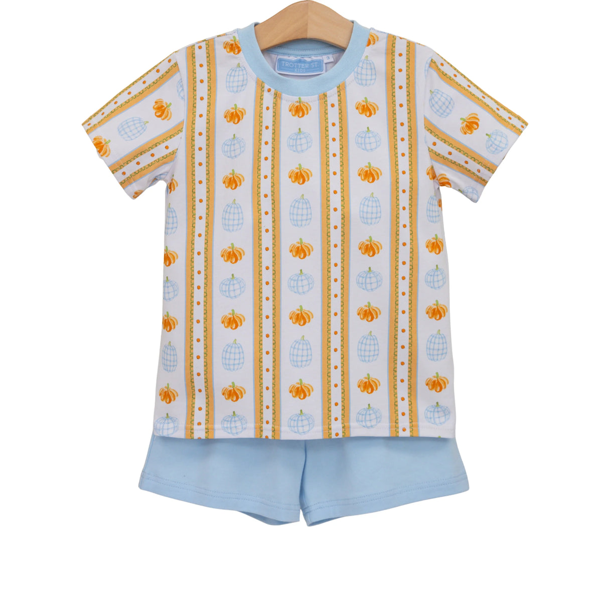 A children's two-piece pajama set featuring a short-sleeve top and matching shorts. The top is white with vertical stripes of orange pumpkins, light blue lanterns, and gold dotted borders, with a light blue collar.