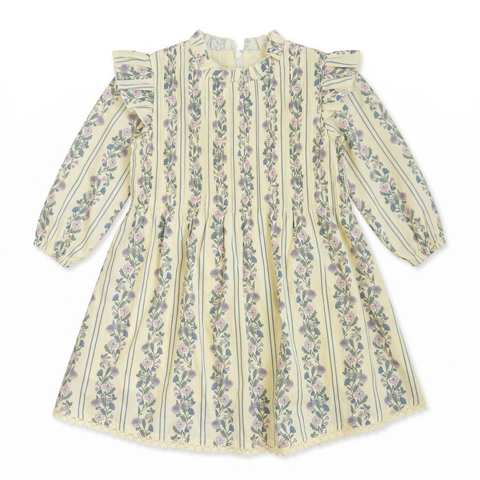 A long-sleeve cream-colored dress with vertical stripes and pink floral patterns, featuring ruffled shoulders and a lace hem.