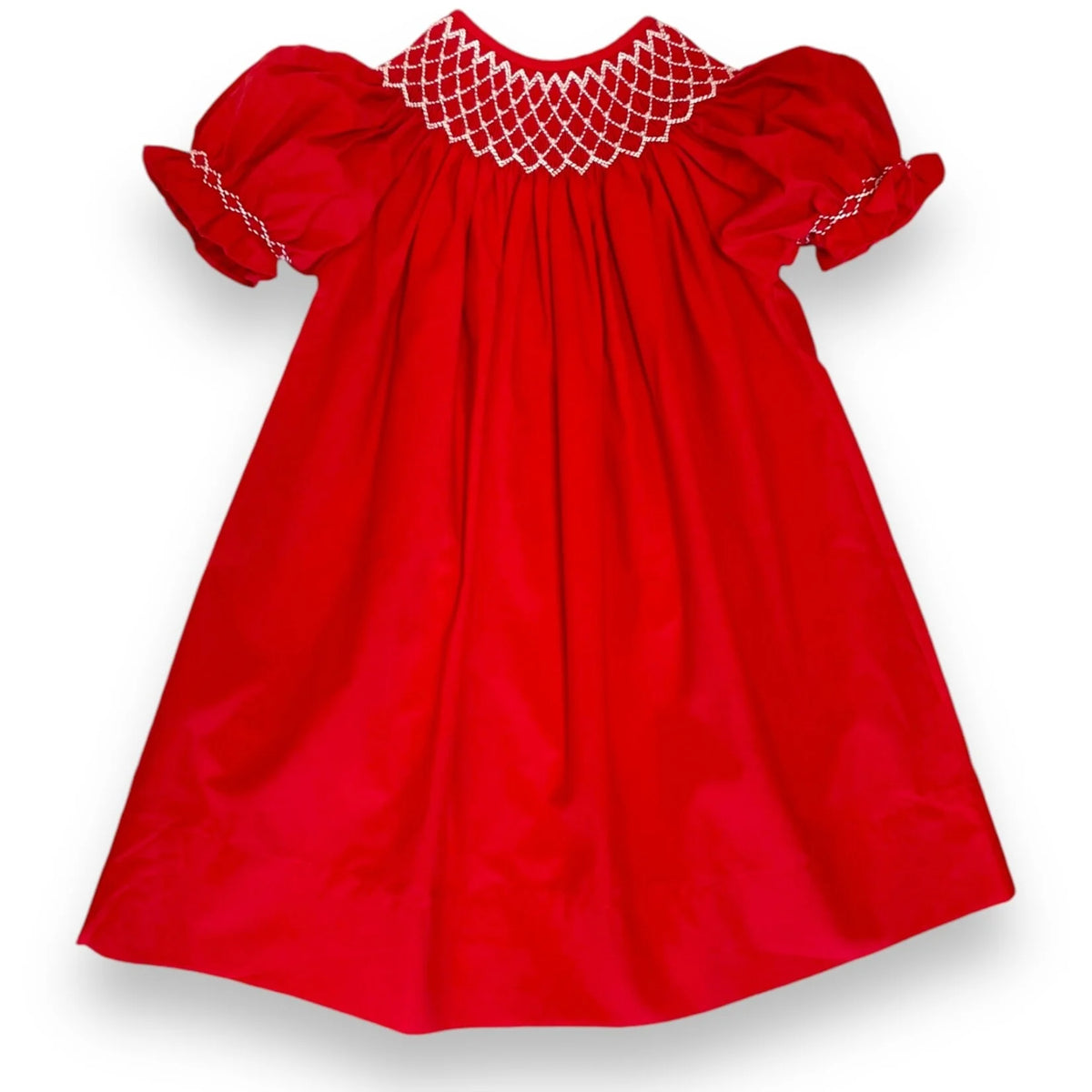 A bright red baby dress with short puff sleeves and white smocked detailing around the neckline and sleeve cuffs, shown against a plain white background.