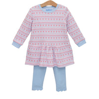 A toddler girl's two-piece outfit set consisting of a long-sleeve tunic top and matching leggings, hanging on a wooden hanger against a plain white background. The tunic features a pink and white fair isle pattern with reindeer motifs, while the leggings are a solid light blue with scalloped hems.