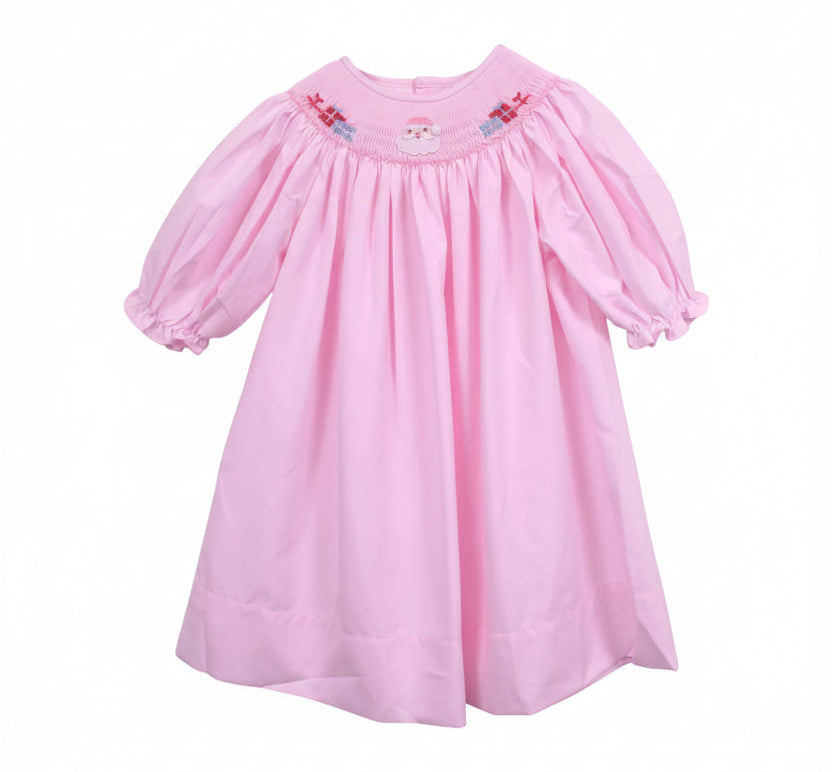 A pink baby dress with short puff sleeves, a smocked neckline, and small embroidered details, hanging on a white hanger against a white background.