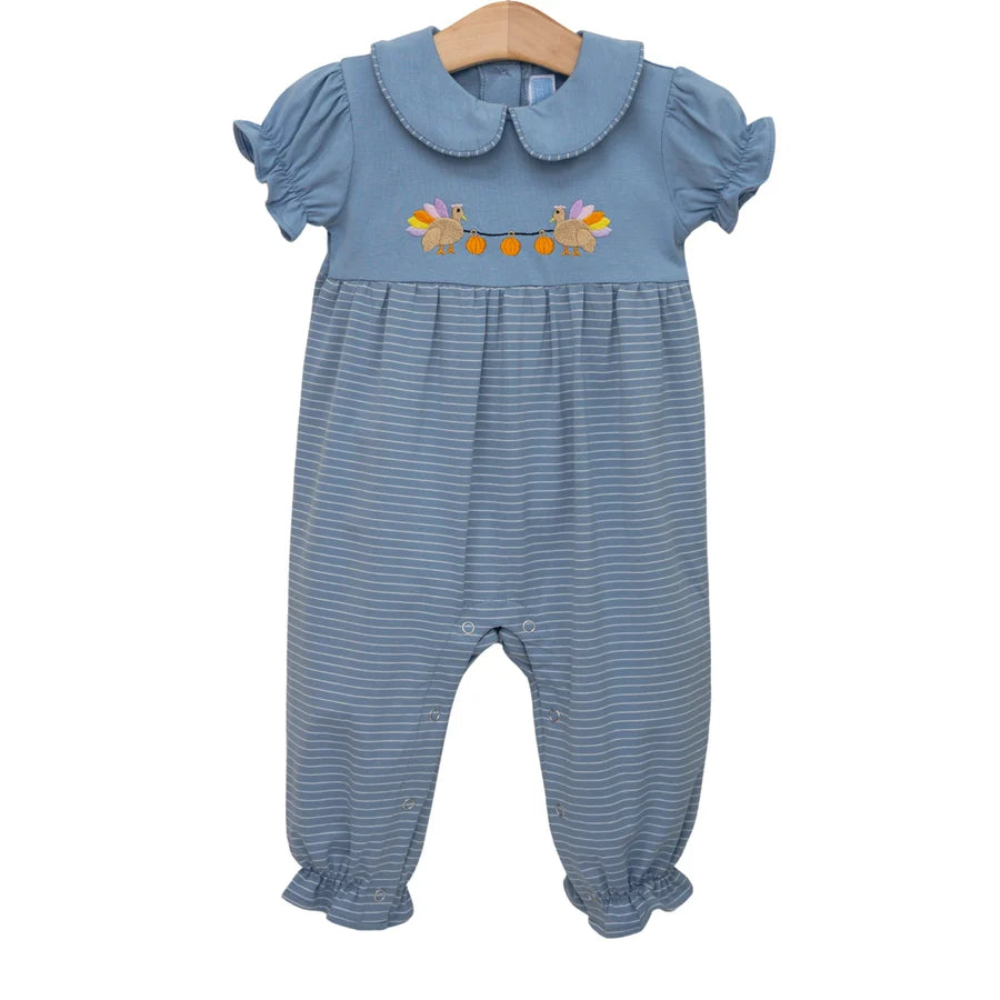 A baby's short-sleeve jumpsuit in dusty blue with fine horizontal stripes, featuring a Peter Pan collar and an embroidered floral design on the chest, hanging on a wooden hanger against a white background.