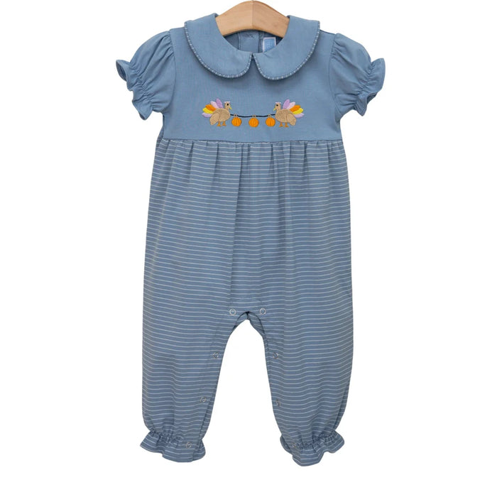 A baby's short-sleeve jumpsuit in dusty blue with fine horizontal stripes, featuring a Peter Pan collar and an embroidered floral design on the chest, hanging on a wooden hanger against a white background.